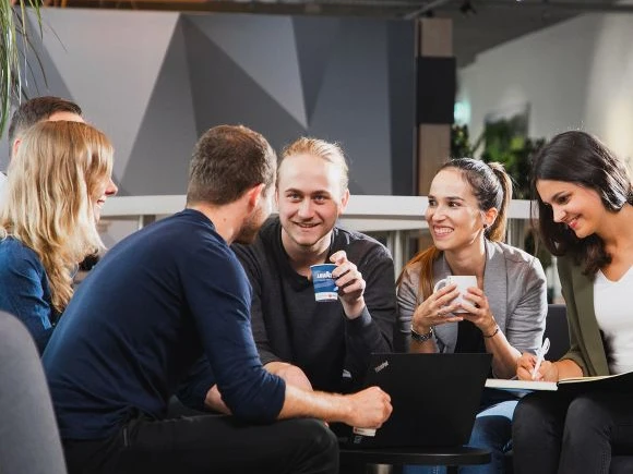 group of people enjoying office coffee